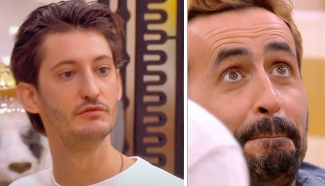 a man looking up and making a face