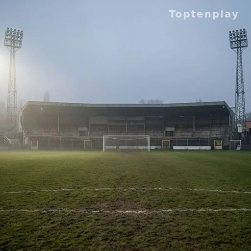 Stade de football années 1980 avec pelouse et éclairage nocturne